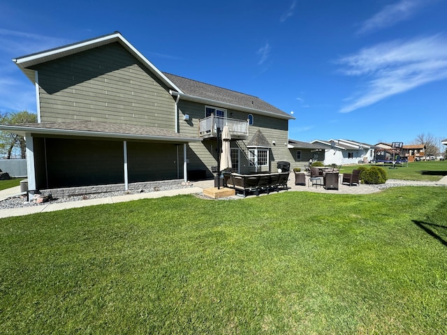310 7th St SW, Roseau, MN 56751 - rear view of property with a patio, a yard, a shingled roof, and a balcony
