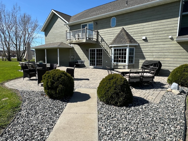 310 7th St SW, Roseau, MN 56751 - rear view of property with a balcony, a patio, and an outdoor hangout area