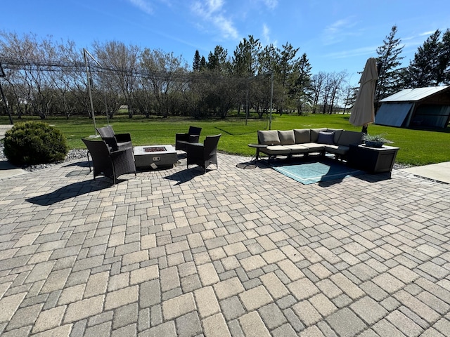 310 7th St SW, Roseau, MN 56751 - view of patio featuring an outdoor living space with a fire pit