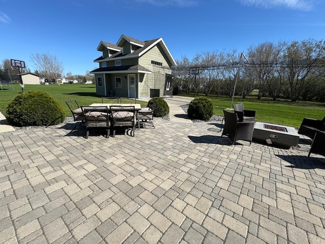310 7th St SW, Roseau, MN 56751 - view of patio featuring a fire pit and outdoor dining area