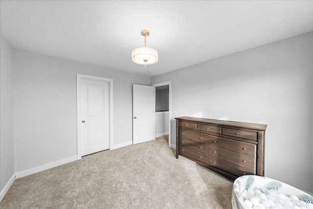 bedroom featuring light colored carpet