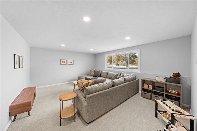 carpeted living room featuring a textured ceiling