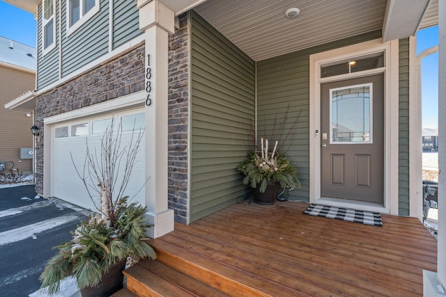 entrance to property featuring a garage