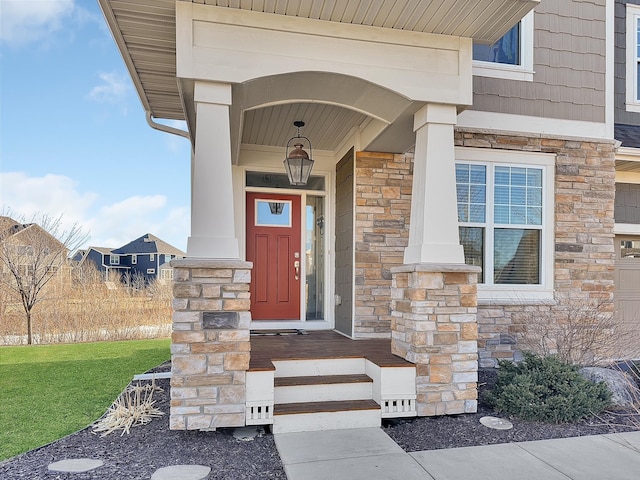 entrance to property with stone siding