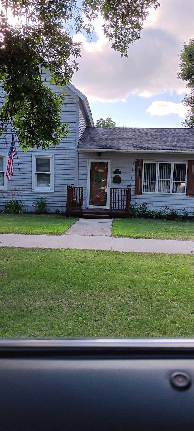 view of front of home with a yard