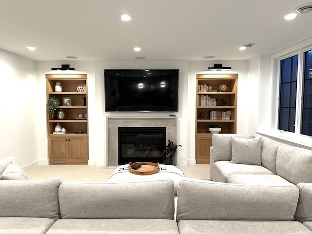 living room featuring a premium fireplace