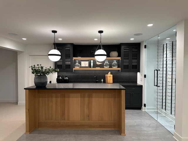 bar featuring decorative light fixtures and decorative backsplash