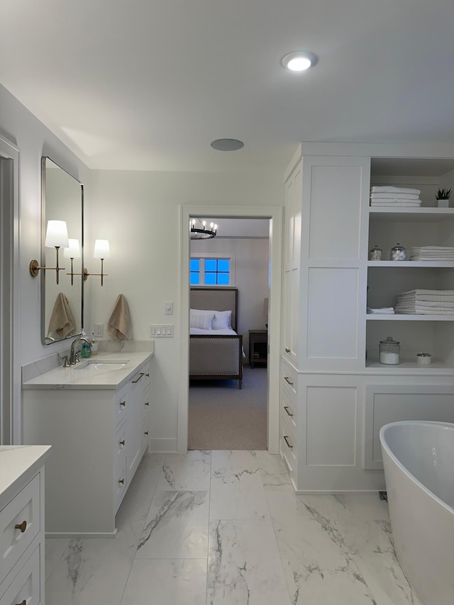 bathroom with vanity and a bathtub