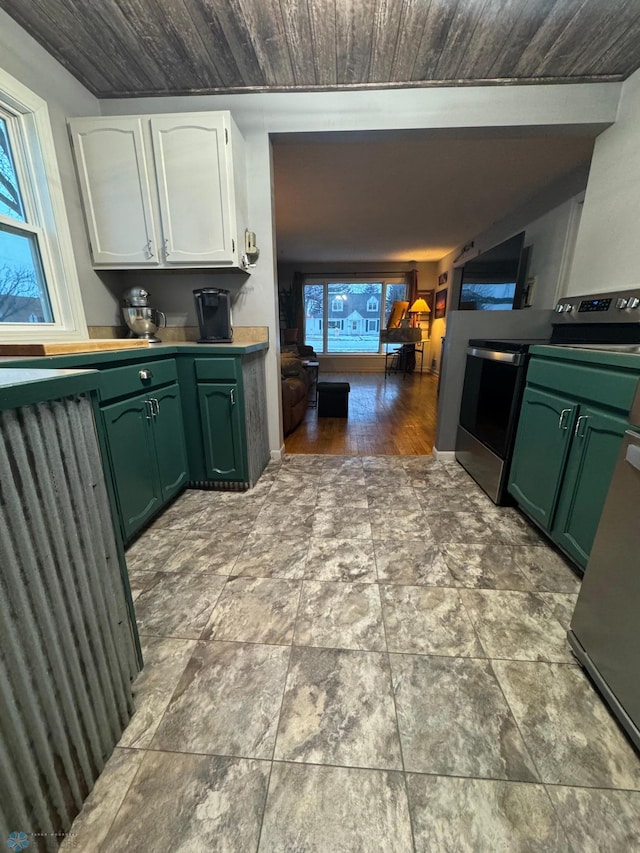 kitchen with wood ceiling, white cabinets, green cabinets, and stainless steel range with electric stovetop