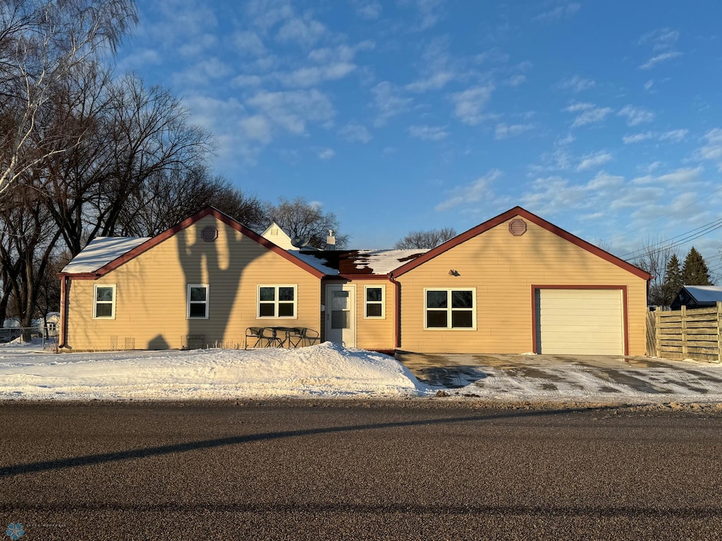 ranch-style house featuring a garage