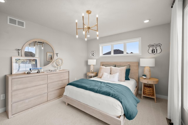 bedroom featuring light carpet and a notable chandelier