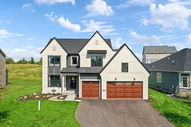 view of front facade featuring a garage and a front yard