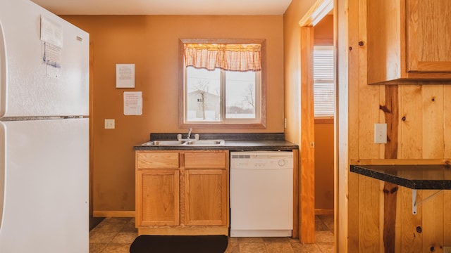 kitchen featuring sink and white appliances