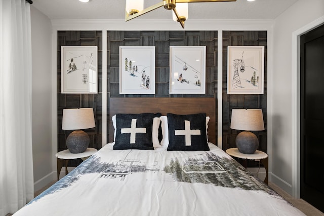 bedroom featuring a textured ceiling and crown molding