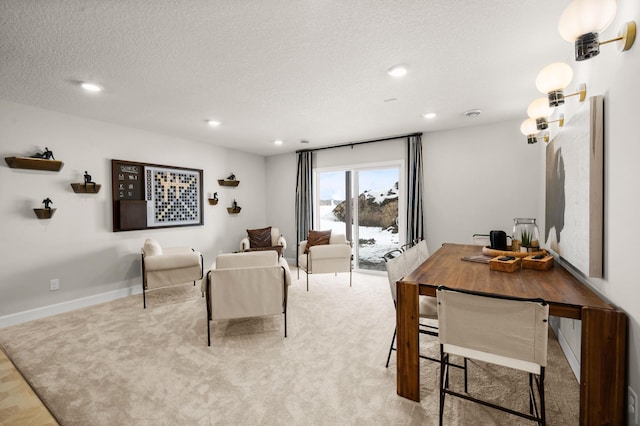 living room with a textured ceiling and light carpet