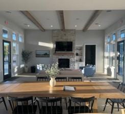 dining area with beam ceiling and a fireplace