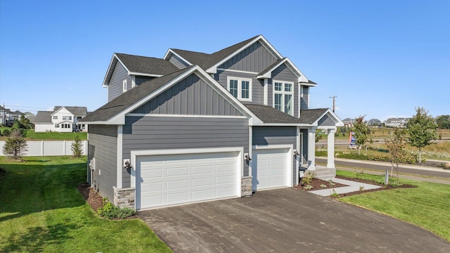 view of front of property featuring a garage and a front yard