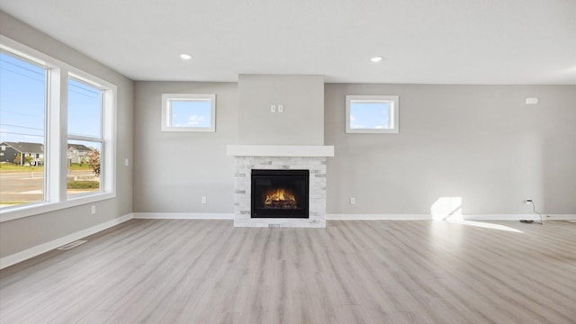 unfurnished living room featuring light hardwood / wood-style flooring