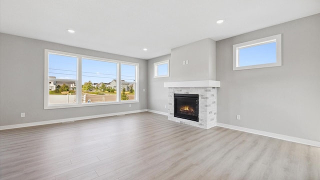 unfurnished living room featuring light wood-type flooring