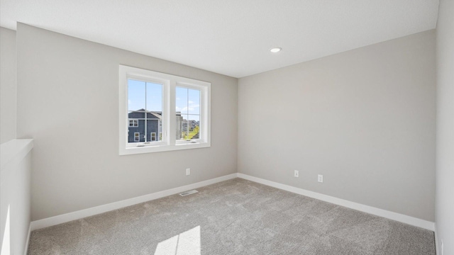 empty room with carpet flooring