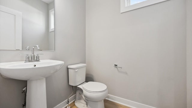 bathroom featuring toilet and sink