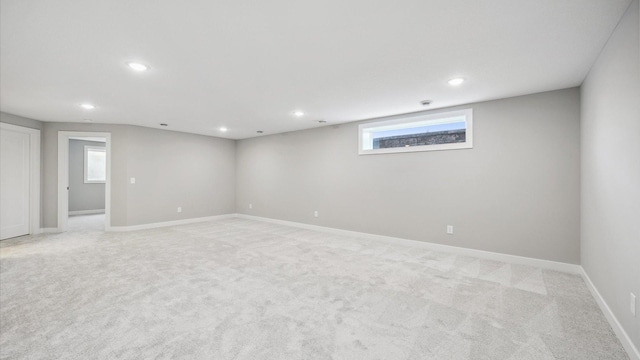 unfurnished room with light carpet