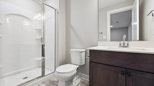 bathroom featuring toilet, walk in shower, and vanity