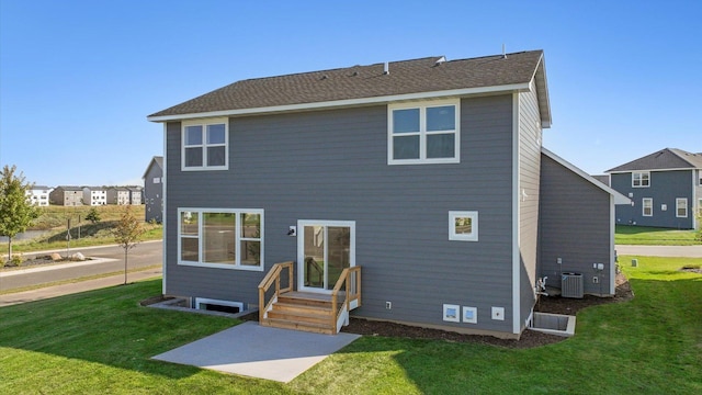 rear view of property featuring a patio area, cooling unit, and a lawn