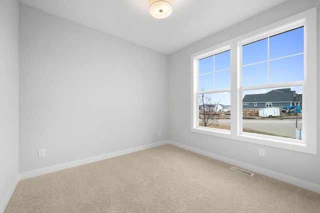 unfurnished room featuring carpet flooring