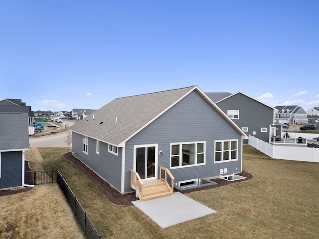 rear view of house with a yard