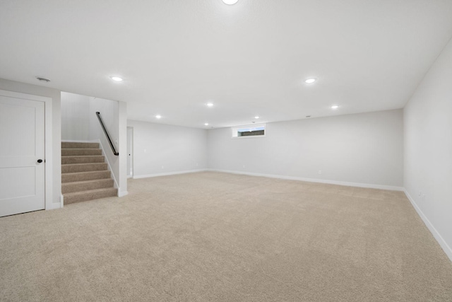 10142 Arrowwood Trl, Woodbury, MN 55129 - basement featuring recessed lighting, light carpet, stairs, and baseboards