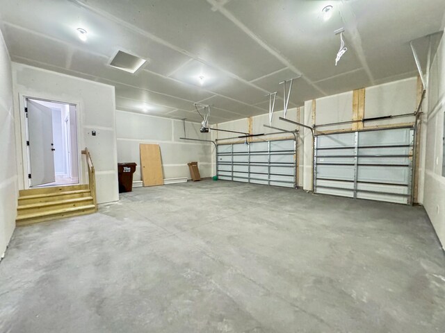 10142 Arrowwood Trl, Woodbury, MN 55129 - garage featuring a garage door opener
