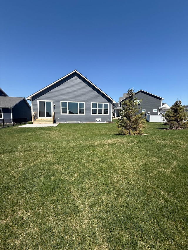 10142 Arrowwood Trl, Woodbury, MN 55129 - back of property featuring a lawn and a patio