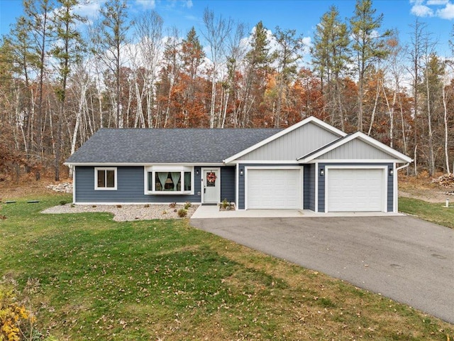 ranch-style house with a garage and a front yard