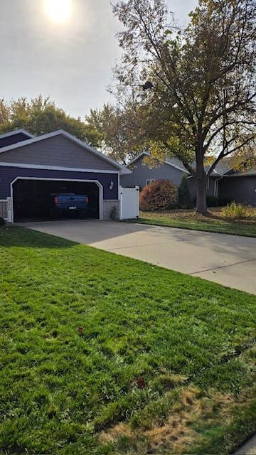 exterior space featuring a garage and a front lawn