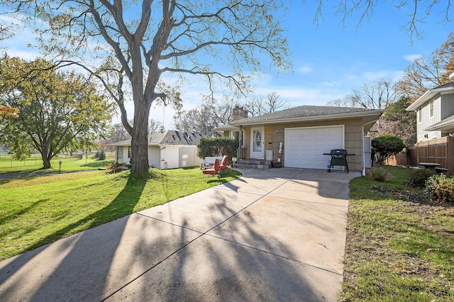 ranch-style home with a front lawn and a garage