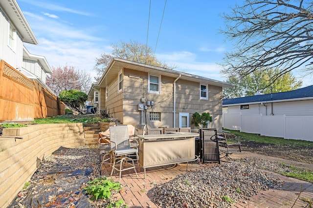 back of house featuring a patio