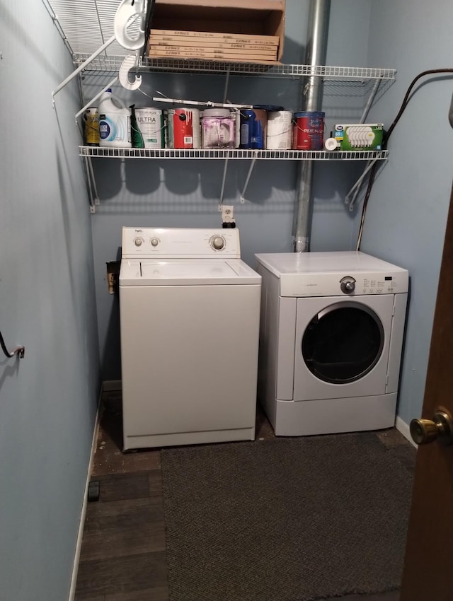 laundry room featuring laundry area, independent washer and dryer, wood finished floors, and baseboards