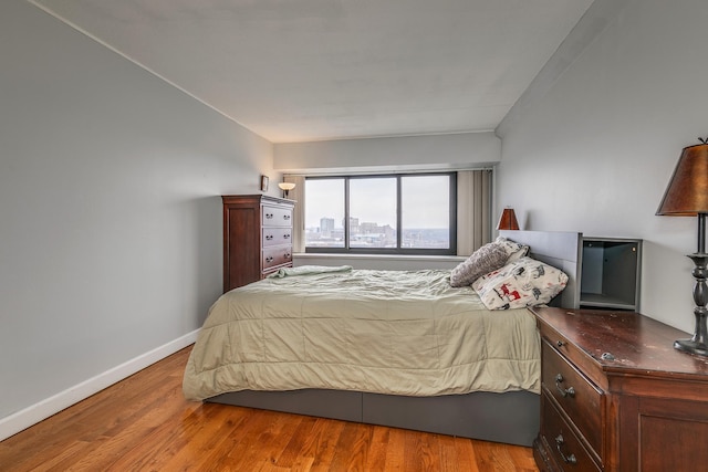 bedroom with light hardwood / wood-style floors