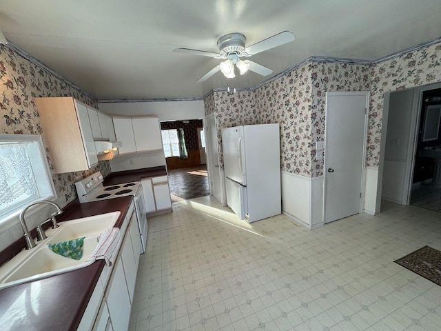 kitchen with ceiling fan, white appliances, sink, and white cabinets