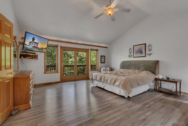 bedroom featuring access to outside, ceiling fan, light hardwood / wood-style floors, and lofted ceiling