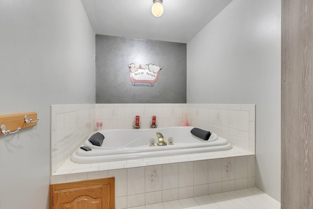 bathroom with tiled bath and tile patterned flooring