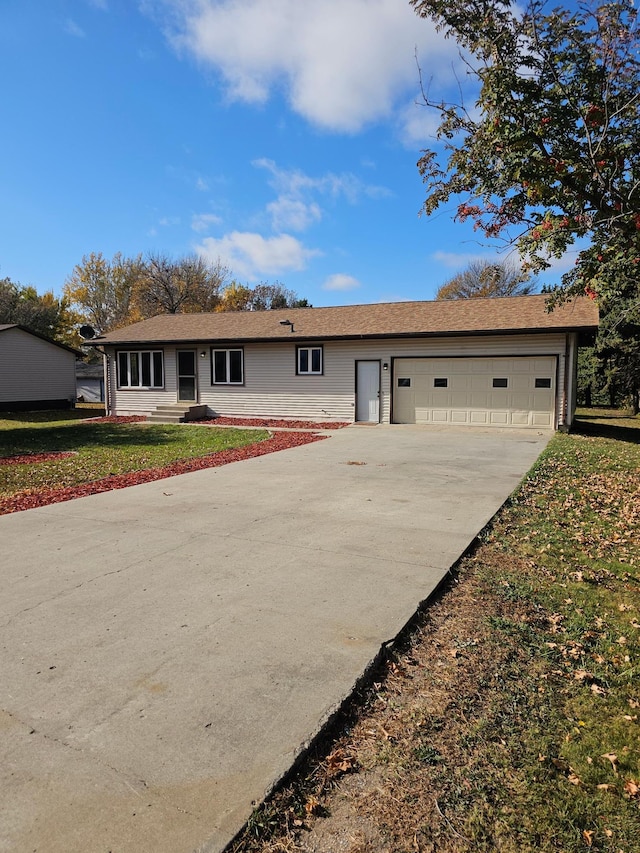 single story home featuring a front yard and a garage