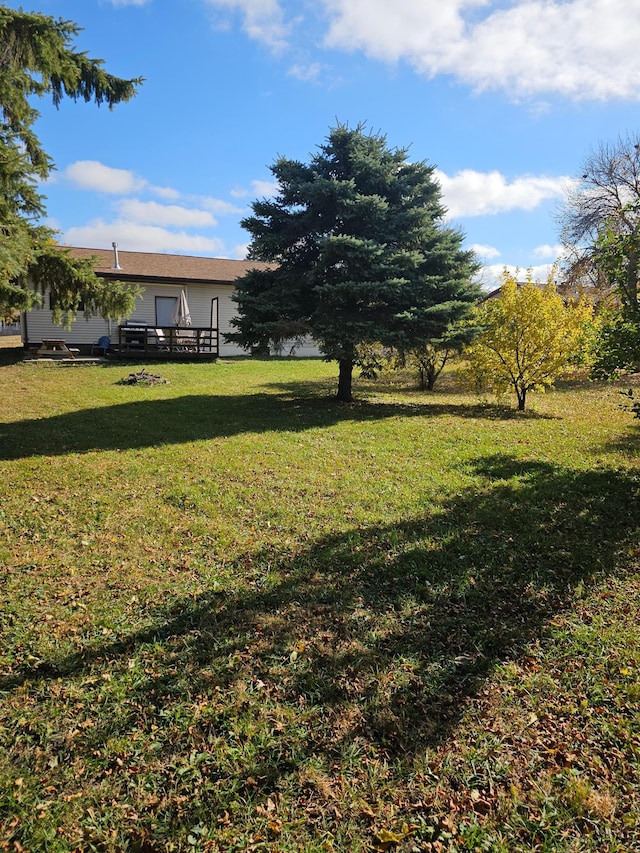 view of yard featuring a deck