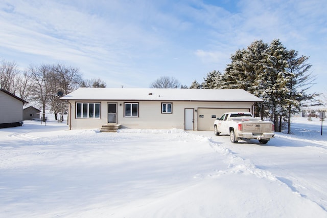 view of front of property featuring a garage