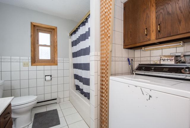 full bathroom featuring washer / dryer, a baseboard heating unit, tile patterned floors, toilet, and tile walls