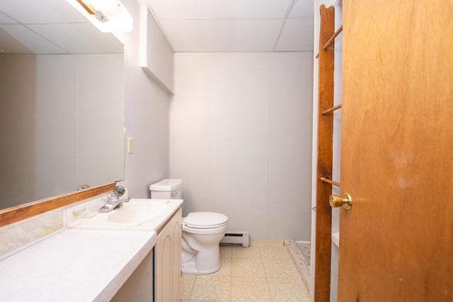 bathroom with vanity, a baseboard radiator, and toilet