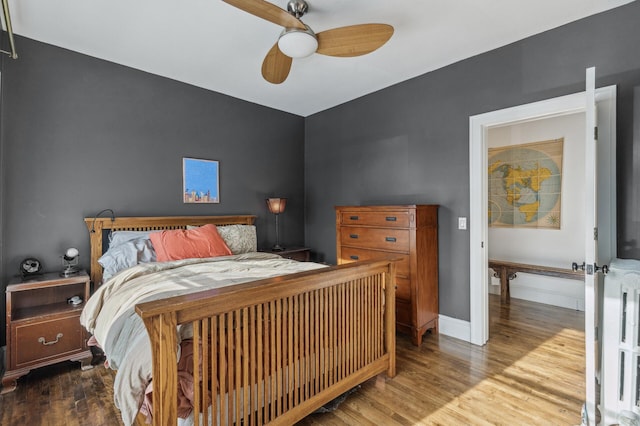 bedroom featuring hardwood / wood-style floors and ceiling fan