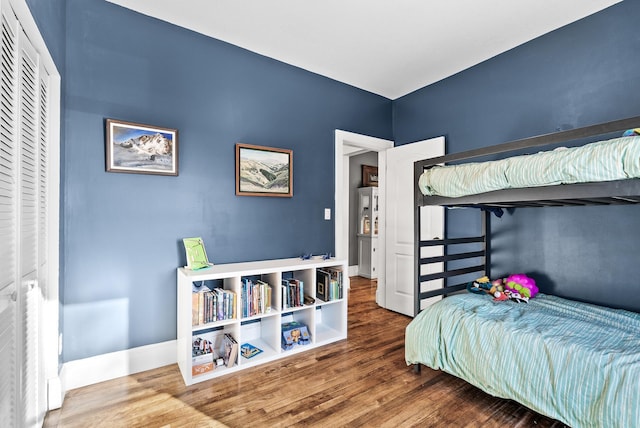 bedroom with wood-type flooring