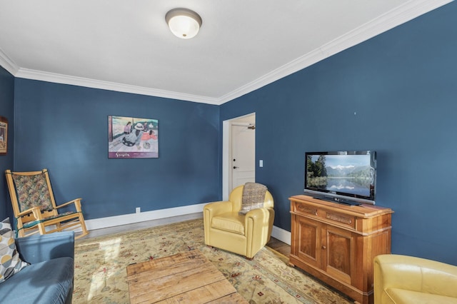 interior space with crown molding, wood finished floors, and baseboards